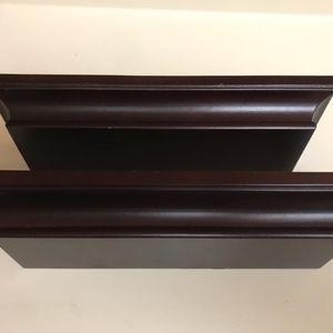 Two dark brown shelves